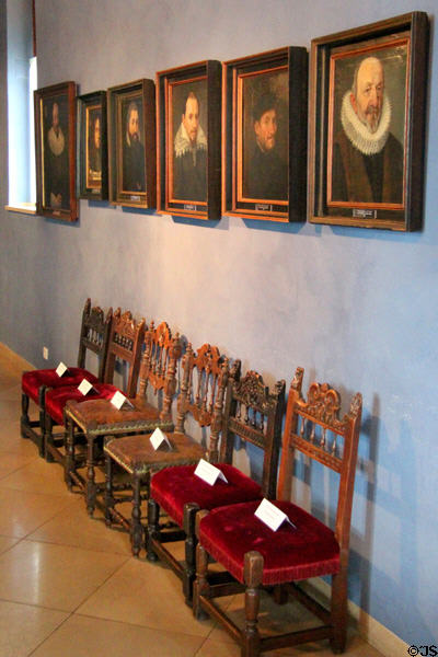 Family portraits over side chairs at Tucher Mansion Museum. Nuremberg, Germany.