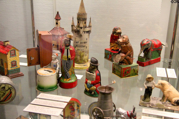 Tin coin banks (early 20thC) some used to raise money for causes at City Toy Museum. Nuremberg, Germany.
