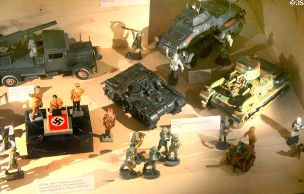 Toy German soldiers & weapons from WWII including figures of Hitler & other Nazis (1935-40) at City Toy Museum. Nuremberg, Germany.