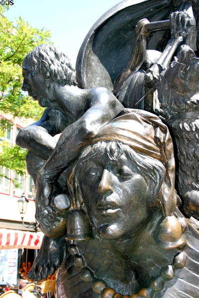 Face with cap of bells on Ship of Fools sculpture. Nuremberg, Germany.