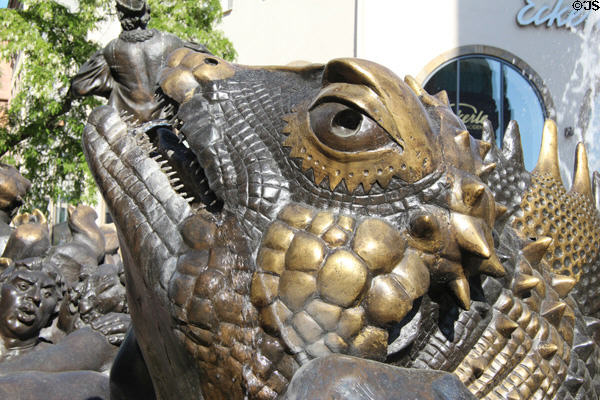 Detail of lizard face on Marriage Carousel sculpture fountain located near White Tower. Nuremberg, Germany.