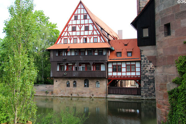 Half timber building beside Water Tower over Pegnitz River. Nuremberg, Germany.