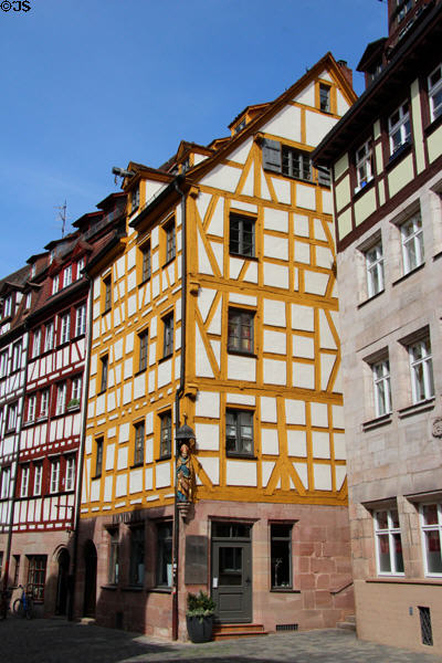 Yellow half-timbered building on Weißgerbergasse. Nuremberg, Germany.
