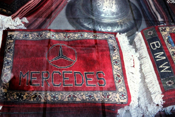 Persian carpet car mats for Mercedes & BMW in shop window. Nuremberg, Germany.