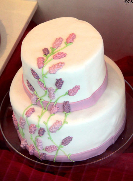 Two layer cake with lilac colored icing flowers. Nuremberg, Germany.