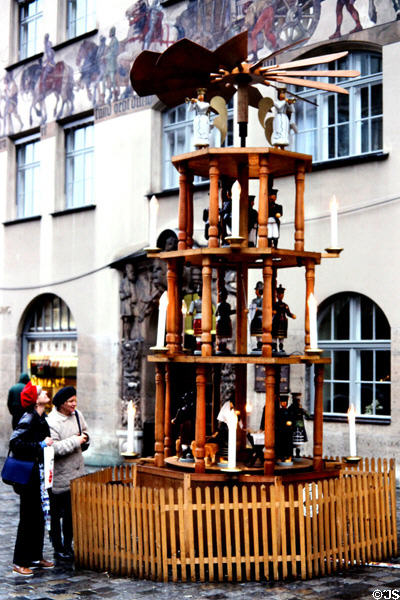 Giant rotating Christmas pyramid at Christmas Market on City Hall square. Nuremberg, Germany.