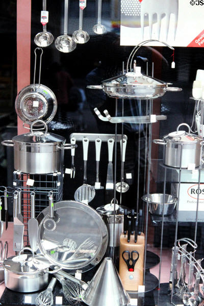Kitchenware store front window display of stainless steel pots & utensils. Würzburg, Germany.