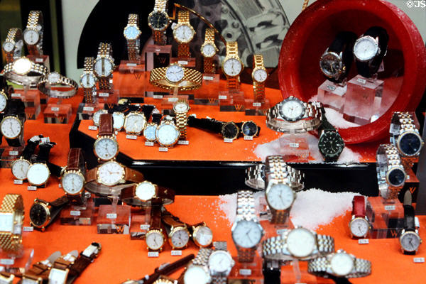 Store window displaying large array of watches. Würzburg, Germany.