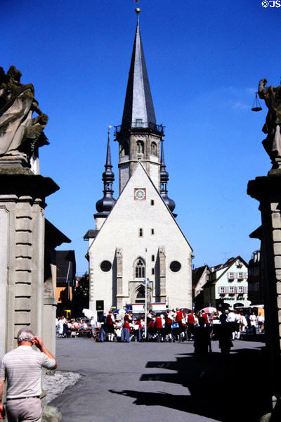 Festive crowd gathering in front of local church. Bad Mergentheim, Germany.