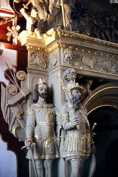 Statues of knights next to fireplace in Knights' Hall at Weikersheim Palace. Weikersheim, Germany.