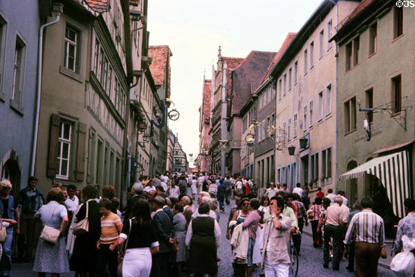 Summer visitors on main street. Rothenburg ob der Tauber, Germany.