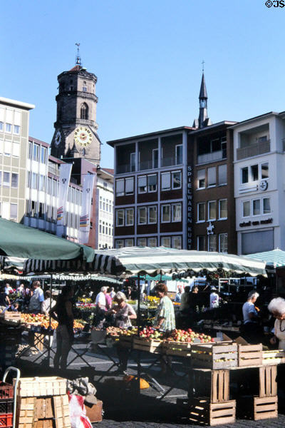Outdoor market at City Hall square with Stiftskirche (Collegiate Church) in background. Stuttgart, Germany.