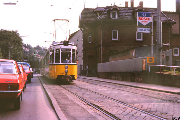 Street car with pantograph running along city street. Stuttgart, Germany.