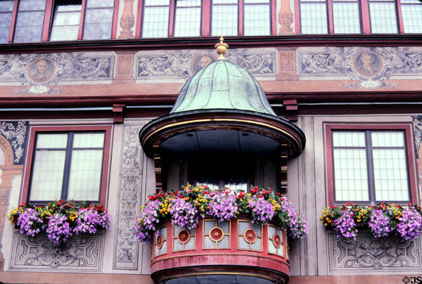 Small covered flower bedecked balcony on Rathaus (city hall) (15thC). Tübingen, Germany.