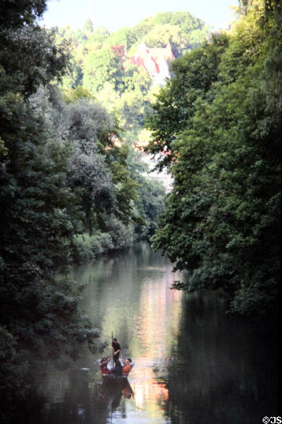 Boaters on Neckar river which flows through city. Tübingen, Germany.