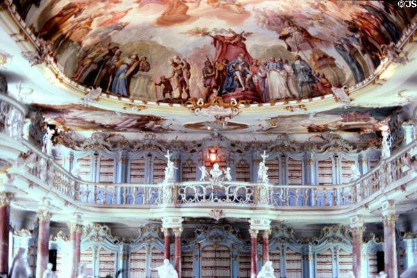 Baroque abbey library with ceiling frescoes (1757) by Franz Georg Hermann & curving gallery by Fidelis Sporer. Bad Schussenried, Germany.