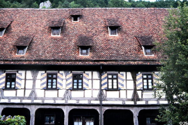 Half-timbered building with tiled slopped roof & dormer windows at Blaubeuren Abbey. Blaubeuren, Germany.