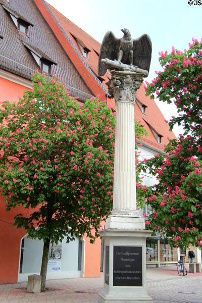 Monument to Memmingen sons lost in war with France (1870-71) surrounded by flowering chestnut trees. Memmingen, Germany.