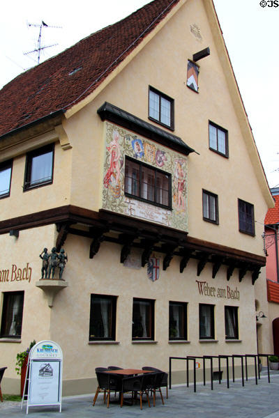 Heritage building decorated with wine scenes on Untere Bachgasse. Memmingen, Germany.