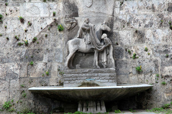 Monument of thanks for city's preservation during bombing of April 26, 1945 on exterior of St Martin Lutheran church. Memmingen, Germany.