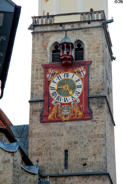 Gothic bell tower (14thC) of St Martin Lutheran church with more modern clock fixed to exterior. Memmingen, Germany.