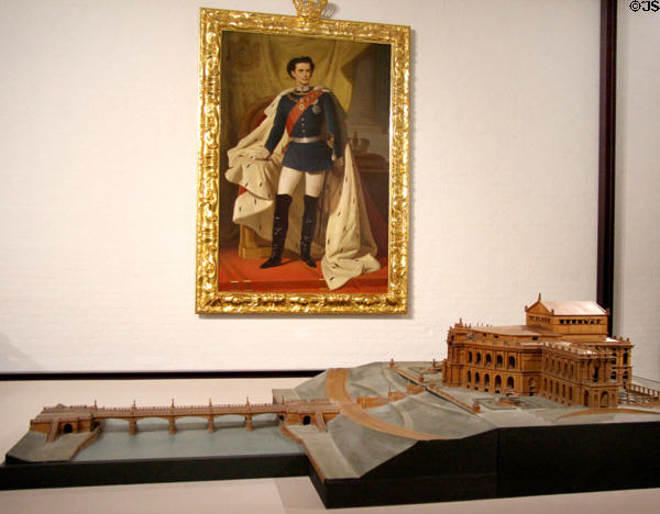 Portrait of King Ludwig II with model (1926-27) for Richard Wagner Festival Theatre in Munich (never built) by Hermann Dürr from original model by Gottfried Semper (1866) at King Ludwig II Museum. Chiemsee, Germany.