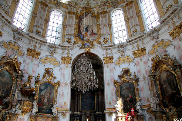 Rococo interior with ornate chandelier hanging from dome of Ettal Benedictine Abbey. Ettal village, Germany.