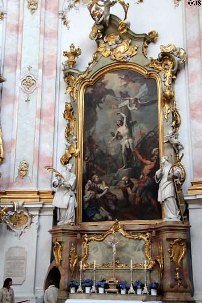 Baroque altar with painting of St Sebastian being pierced by arrows at Ettal Benedictine Abbey. Ettal village, Germany.