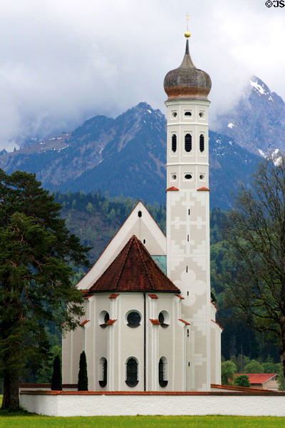 St Coloman baroque church (17thC) in Schwangau in pastoral setting with Alps in background. Füssen, Germany.