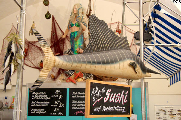 Ornate mermaid on sign for fish seller's shop. Füssen, Germany.