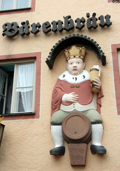 Brewery sign with king sitting on beer barrel. Füssen, Germany.