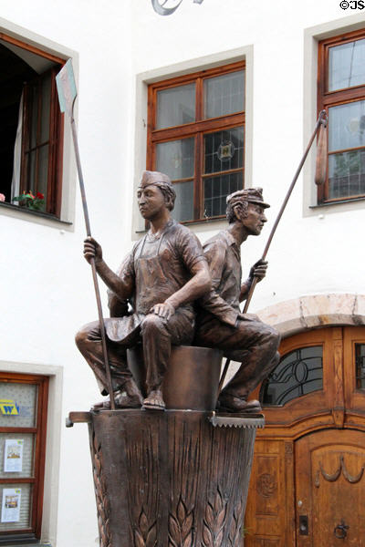 Brotbrunnen dedicated to bread making with figures of bakery workers on Schrannengasse in town center. Füssen, Germany.