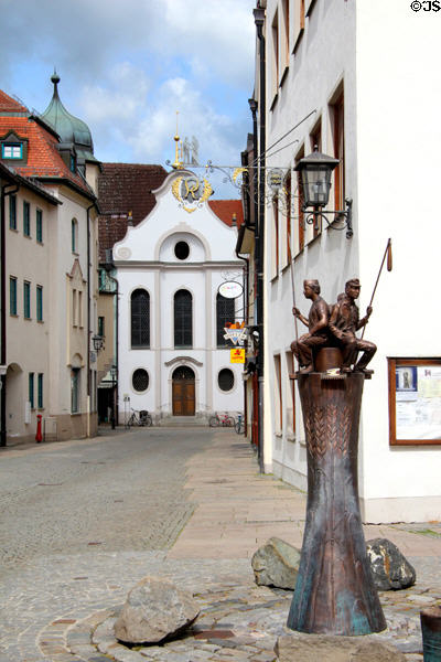 Krippkirche St Nikolaus of Myra & Brottbrunnen sculpture dedicated to bread making. Füssen, Germany.