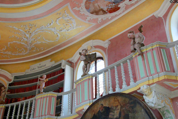 Carvings of cherubs perched on balcony railing in monastery library at Museum of City of Füssen in Kloster St Mang. Füssen, Germany. Architect: Johann Jakob Herkomer.