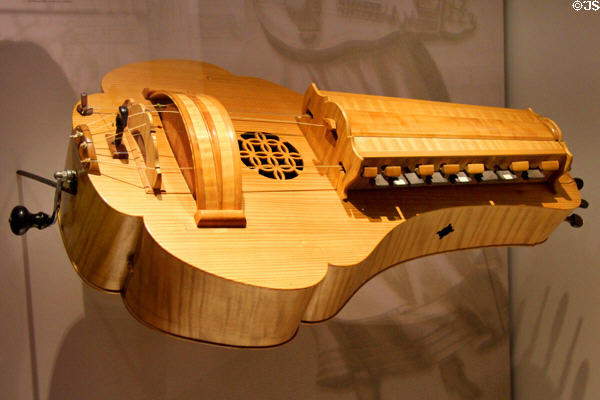 Hurdy Gurdy, a string instrument that produces sound by a hand-crank-turned, rosined wheel rubbing against strings at Museum of City of Füssen in Kloster St Mang. Füssen, Germany.