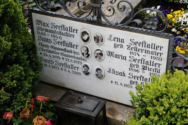 Family tombstone with photos of each member in cemetery of St Aegidius parish church. Gmund am Tegernsee, Germany.