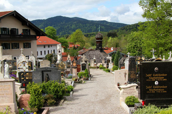St Aegidius parish church cemetery with hills in background. Gmund am Tegernsee, Germany.