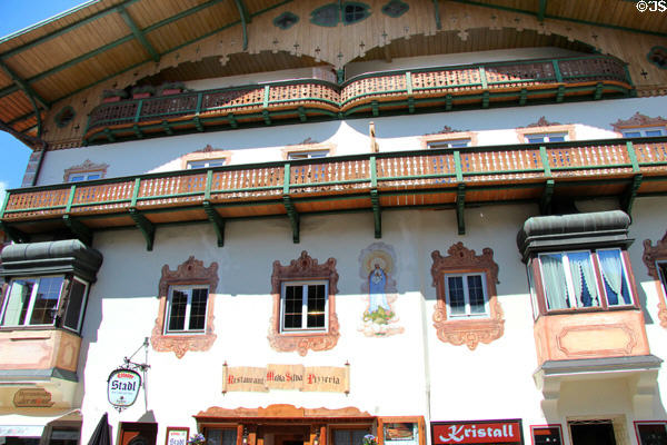 Traditional building with carved wooden balconies, painted designs and oriel windows. Mittenwald, Germany.