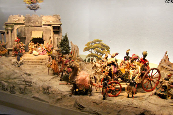 Carved Baroque manger figures (c1900) with wise men arriving by carriage on platform (1962) at Oberammergau Museum. Oberammergau, Germany.