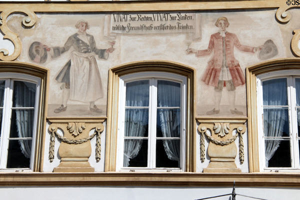 Two wine merchants painted on Marktstraße building. Bad Tölz, Germany.