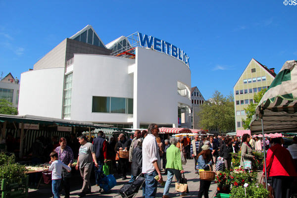 Shoppers & modern building in Market Area. Ulm, Germany.