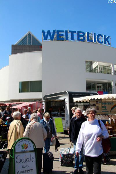 Shoppers & modern building in Market Area. Ulm, Germany.