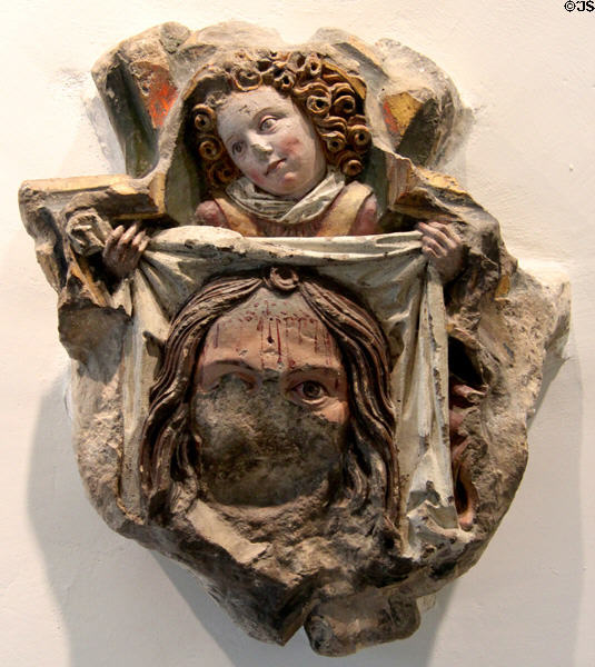 Keystone with sculpture of St Veronica (1490) holding the veil with which she wiped Christ's face as He was led to crucifixion by unknown artist from Kloster Blaubeuren at Ulmer Museum. Ulm, Germany.