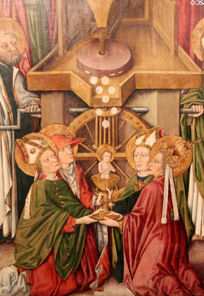 Detail of body of Christ emerging from Machine to make Christian host being received by Bishops painting (c1470) by master of Hostienmühlen-Retabels of Ulm at Ulmer Museum. Ulm, Germany.