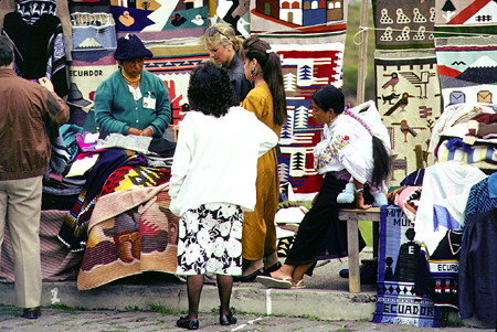 Browsing the wall weavings for sale in Quito. Ecuador.