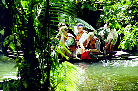 Canoeing through the jungles of along tributaries of the Amazon. Ecuador.