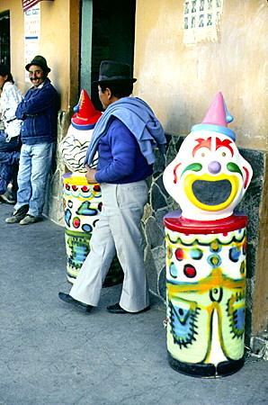 Trash can shaped like clowns decorate the street in a village noted for its ice creams, south of Quito. Ecuador.