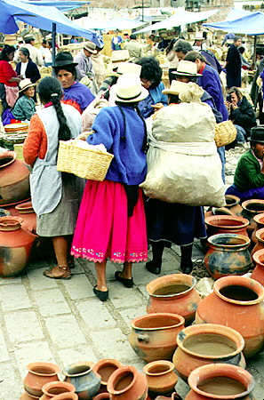Women in native dress in the market of Cuenca. Ecuador.
