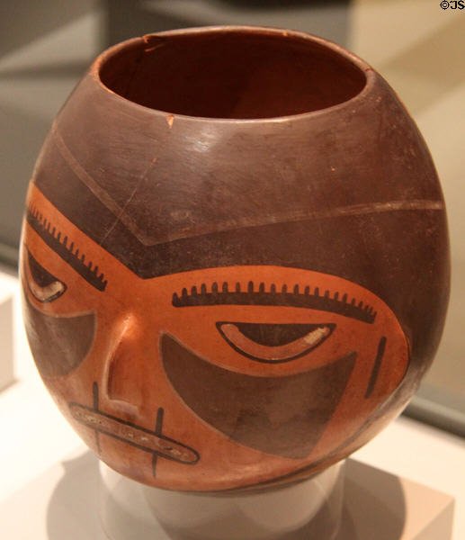 Nazca culture ceramic global vessel with trophy face (100-700) from Peru at Museum of America. Madrid, Spain.