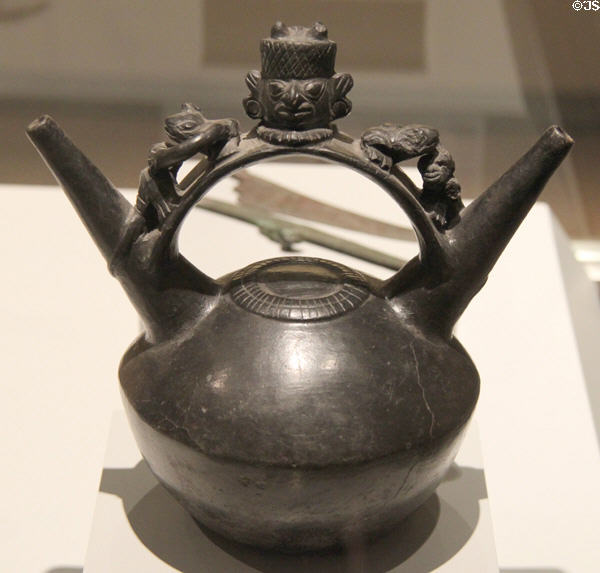 Lambayeque culture ceramic double-spouted bridge-handle vessel with religious scene (1150-1450) from Peru at Museum of America. Madrid, Spain.